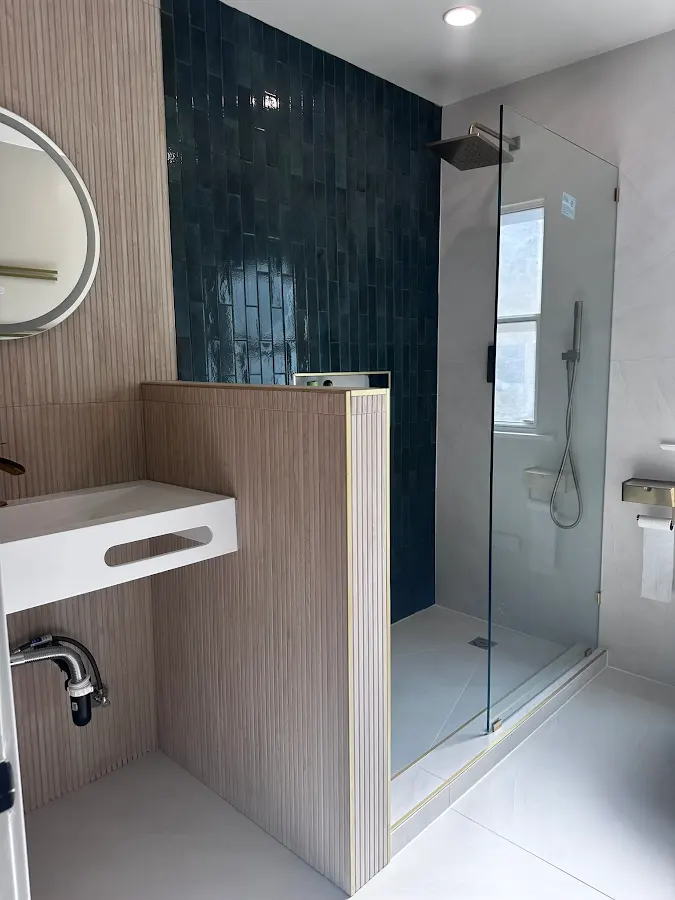 Modern tiled shower renovation by Family Builder