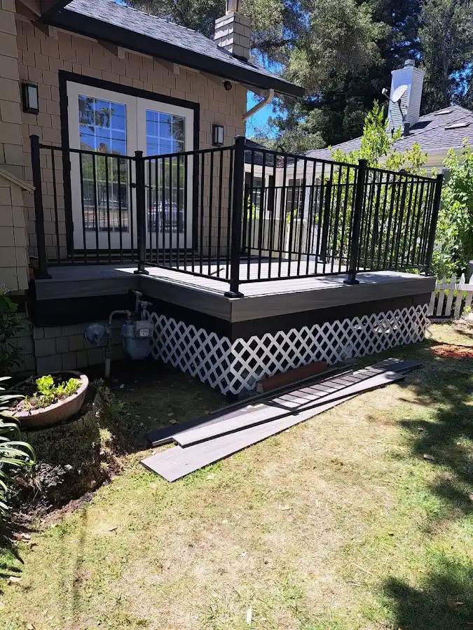 Entry deck with black metal railing