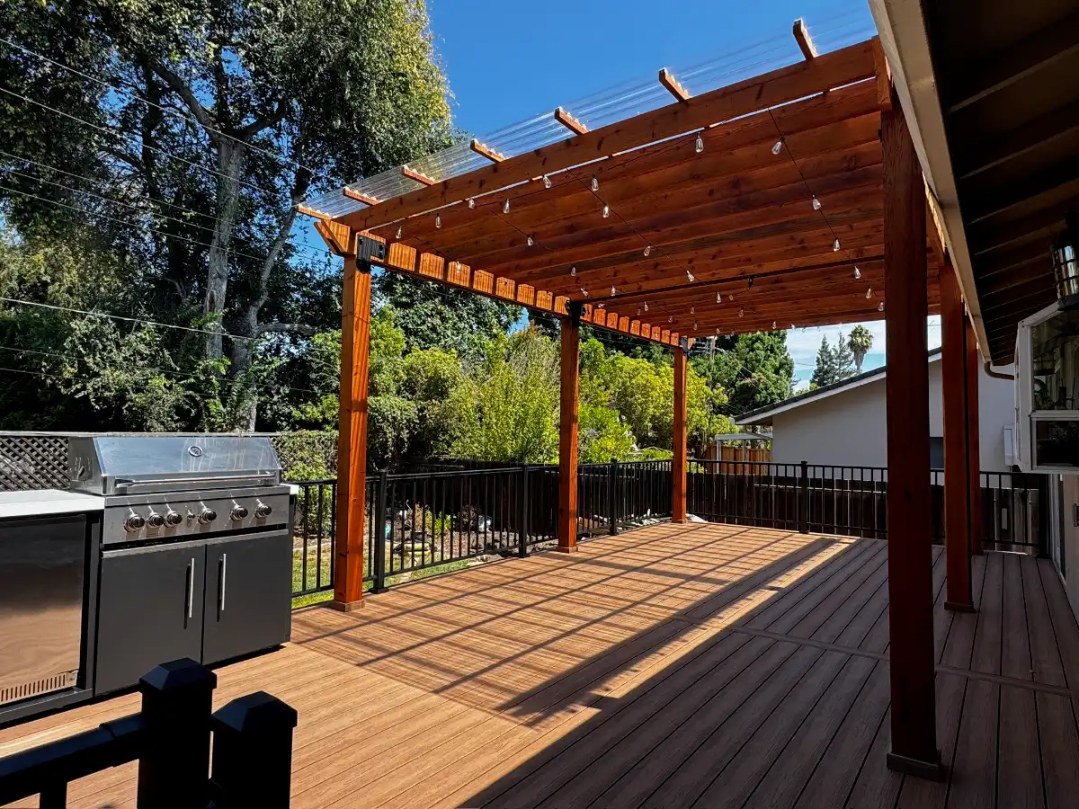 Finished wood deck and pergola with an outdoor grill
