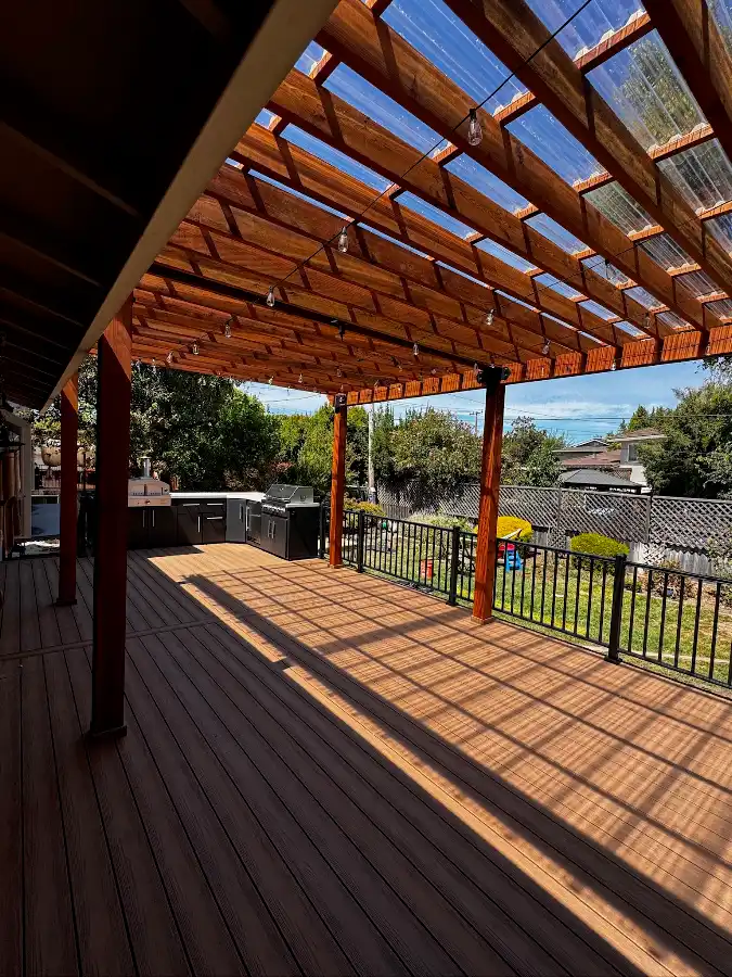 Wood deck beneath a covered pergola