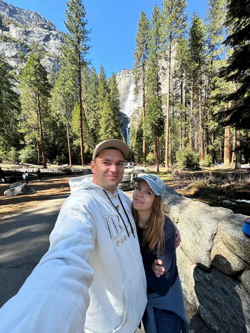 Ivan and his wife on a walk near a waterfall