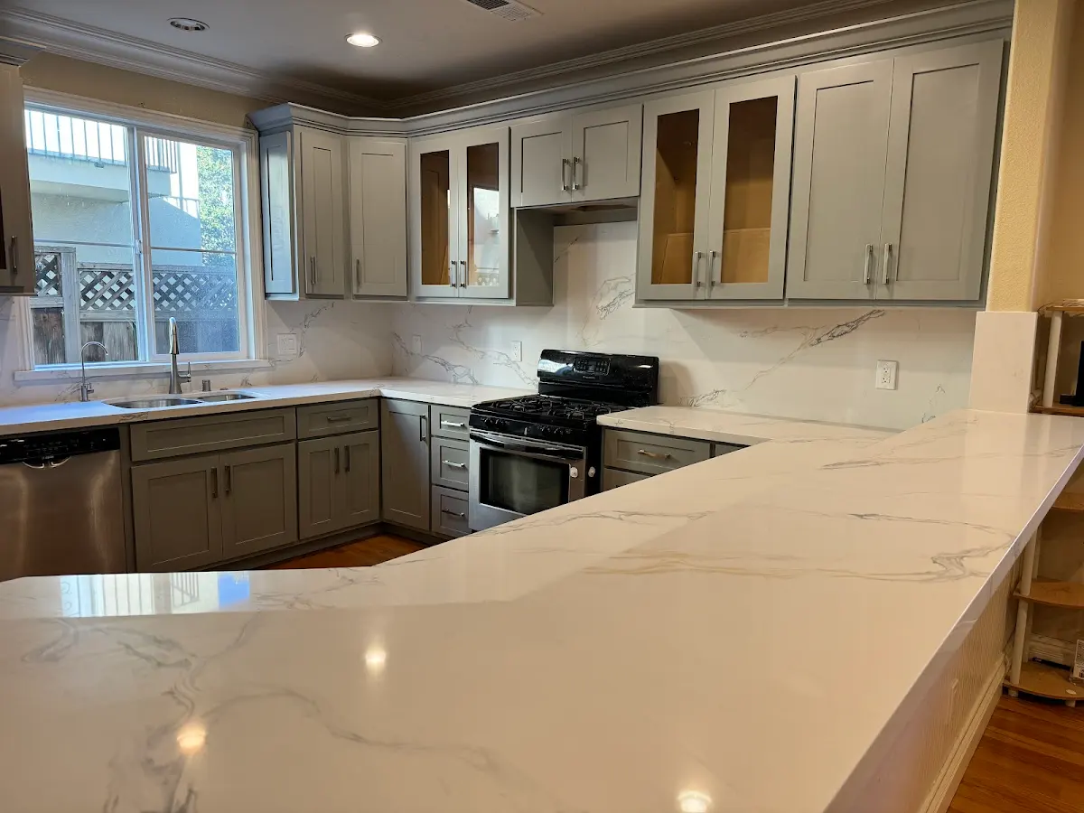 Finished kitchen with light countertops and a peninsula