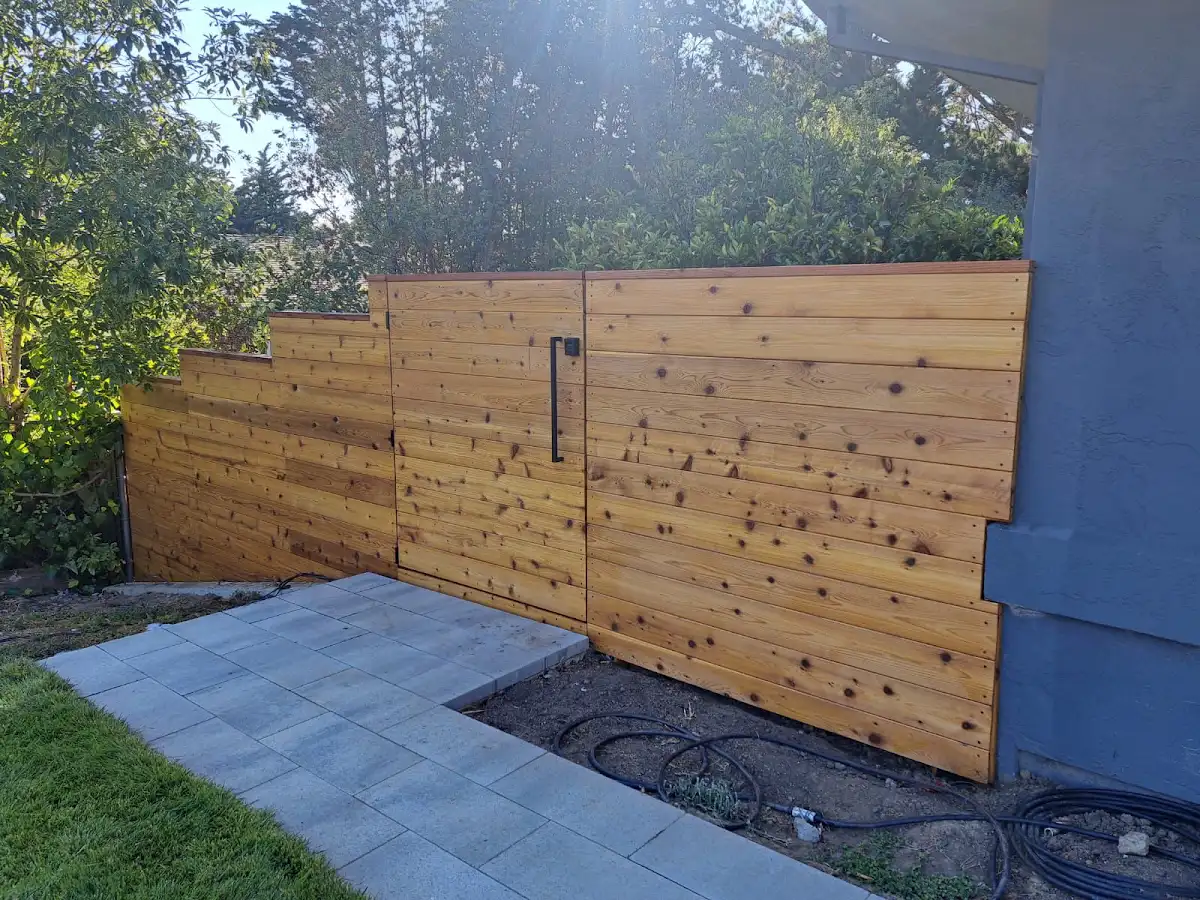 Horizontal wood fence and matching gate built by Family Builder