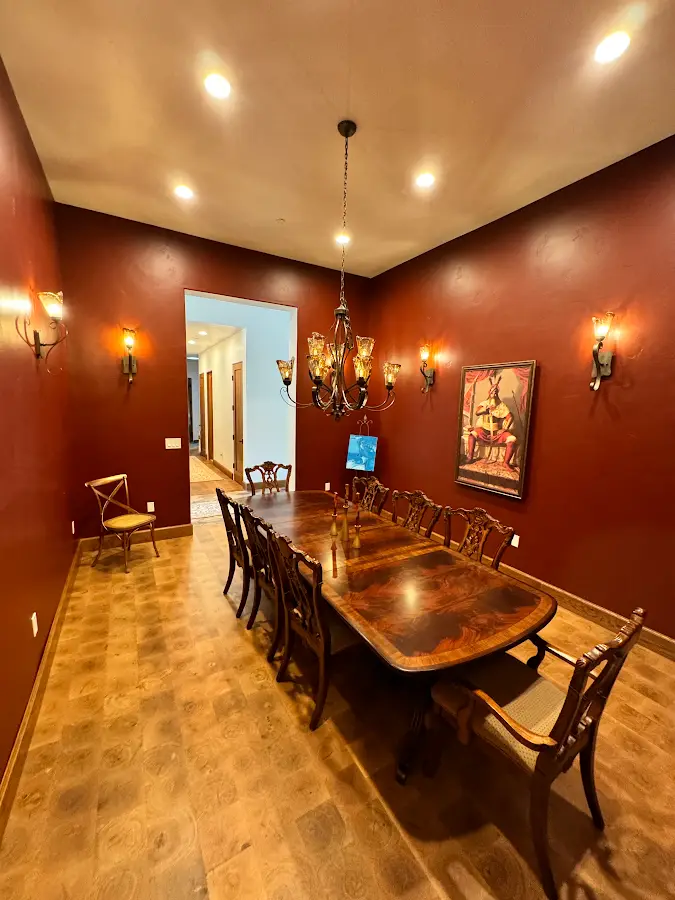 Deep red dining room walls with a light ceiling